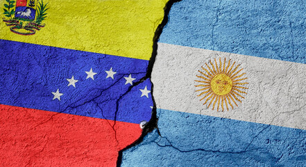 Venezuela and Argentina flags on a stone wall with a crack, illustration of the concept of a global crisis in political and economic relations