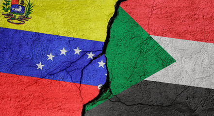 Venezuela and Sudan flags on a stone wall with a crack, illustration of the concept of a global crisis in political and economic relations