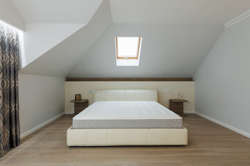 Elegance in White: Close-Up of Bed in Modern Bedroom
