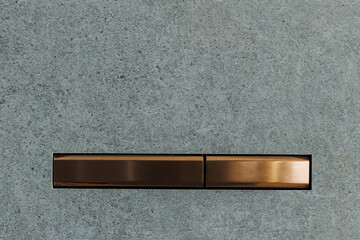 Innovative flush control: Close-up of the blue-grey concealed installation button in a modern...