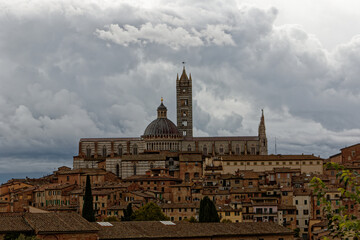 Fototapeta premium Siena. Old Medieval city in Tuscany in Italy Europe. Art and culture. Tourists from all over the world for Piazza del Campo Palio Duomo Tower del Mangia and the oldest bank banco dei Paschi 