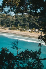 Fototapeten Ohope beach in New Zealand showing beaches, different rock formations, flora and fauna. © Sam