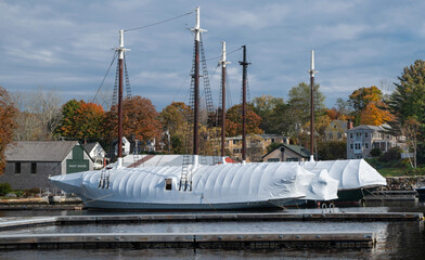 Sailboats in Plastic Wrap:  Large sailboats wear coats of shrink-wrapped plastic in preparation for winter at a New England harbor.
 - Powered by Adobe
