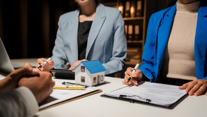 Real estate agent and customer signing contract to buy house, insurance or loan real estate.rent a...
