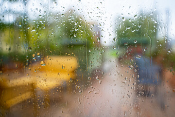 Blurred veranda background during Rain, Defocused photo through wet glass outdoor - obrazy, fototapety, plakaty