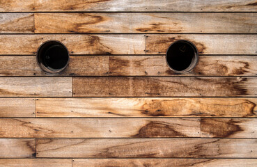 Brown wooden wall texture with portholes