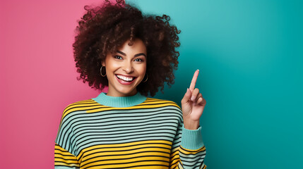 Expression of a happy laughing woman who holds her index finger up to explain or point