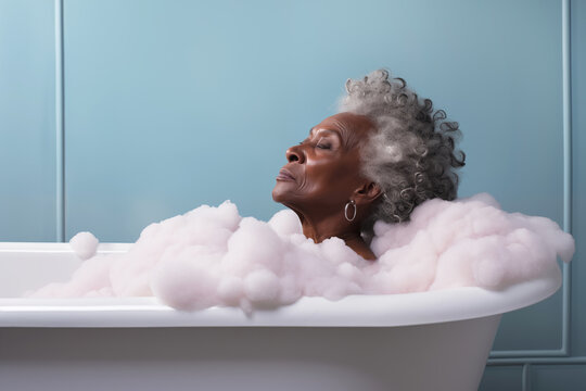 Mature Beautiful African American Woman Relaxing In Bathtub With Foam