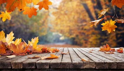 Naklejka na ściany i meble wooden table with orange leaves autumn background