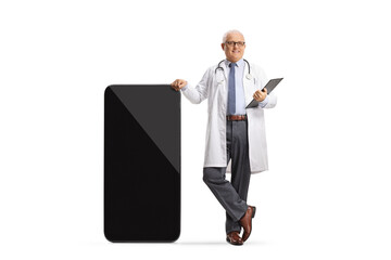 Male doctor leaning on a smartphone