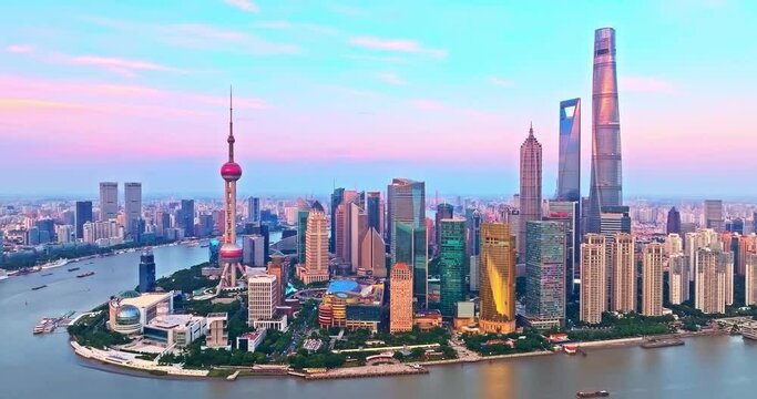 Aerial shot of downtown buildings skyline at sunrise in Shanghai, China. Creative category video without architectural logos