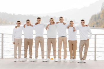 friendship, movement, action, freedom and people concepts - group of happy teenage students or school friends posing and having fun outdoors on beautiful place background.