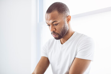 portrait of a man on white appartement with white shirt - Powered by Adobe