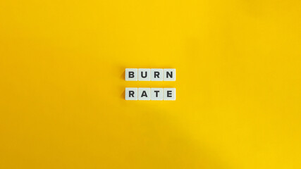 Burn Rate Term in Finance and Business. Text on Block Letter Tiles on Yellow Background. Minimalist Aesthetics. - obrazy, fototapety, plakaty