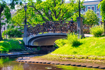 Fototapeta na wymiar Riga, Latvia - July 7, 2017: Riga city park on a sunny summer day