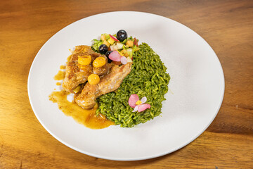 chicken breast with cape gooseberry sauce, green rice and fruit salad