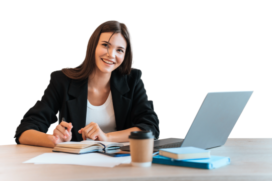 young woman with a friendly expression against transparent background, working diligently. . Dressed in a black blazer over a white top, embodies a business-casual look In front of open laptop