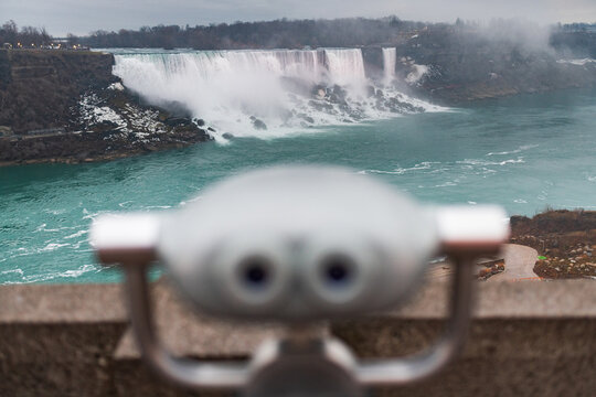 Niagara Falls seen past a tourist binocular viewer from the American side, Niagara Falls, New York
