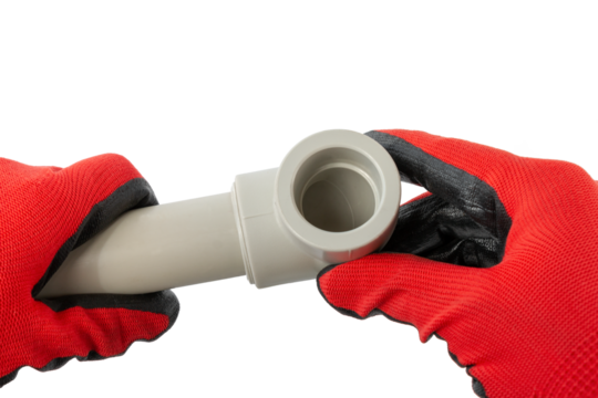 soldered pvc corner with a pipe in the master's hand, cut out