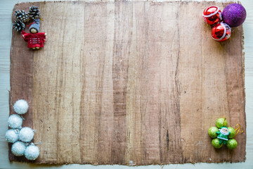 Christmas decoration with balls and angel on old fashioned parchment, papyrus.
