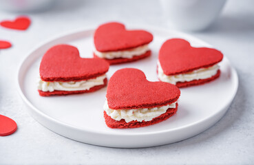 Red velvet whoopie pies in the form of heart for Valentine's day in a plate