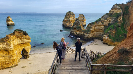 Ponta Da Piedade Rocks Near Lagos in Algarve, Portugal. Cliff Rocks, Seagulls and Tourist Boat on...