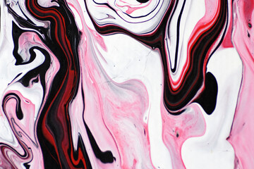 Marbled acrylic colored pattern in the colors red, black, white and pink.