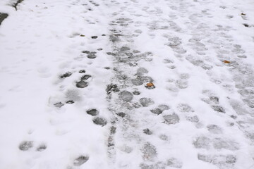 footprints in the snow in the city, ozheliditsya, winter in the city 