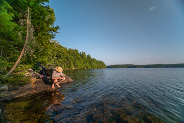 Family hobby, fishing at lake during summer. Throwing fish line reel in the water, fly fishing....