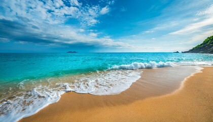 Fototapeta na wymiar beautiful soft blue ocean wave on fine sandy beach