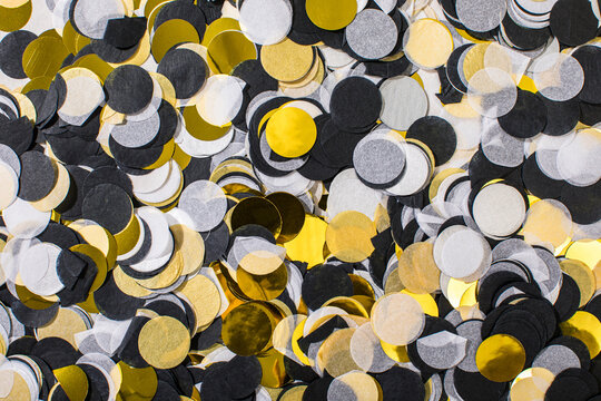 Confetti graphic in black, gold, yellow and silver