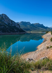Fototapeta na wymiar .A small lake, Torrent de Gorg Blau, located among the rocks in Mallorca, Spain.