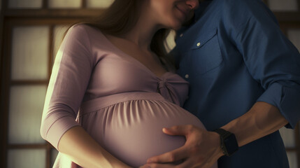 Expectant Couple Embracing, Focus on Pregnant Belly