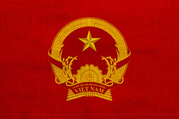 Flag and coat of arms of Socialist Republic of Vietnam on a textured background. Concept collage.