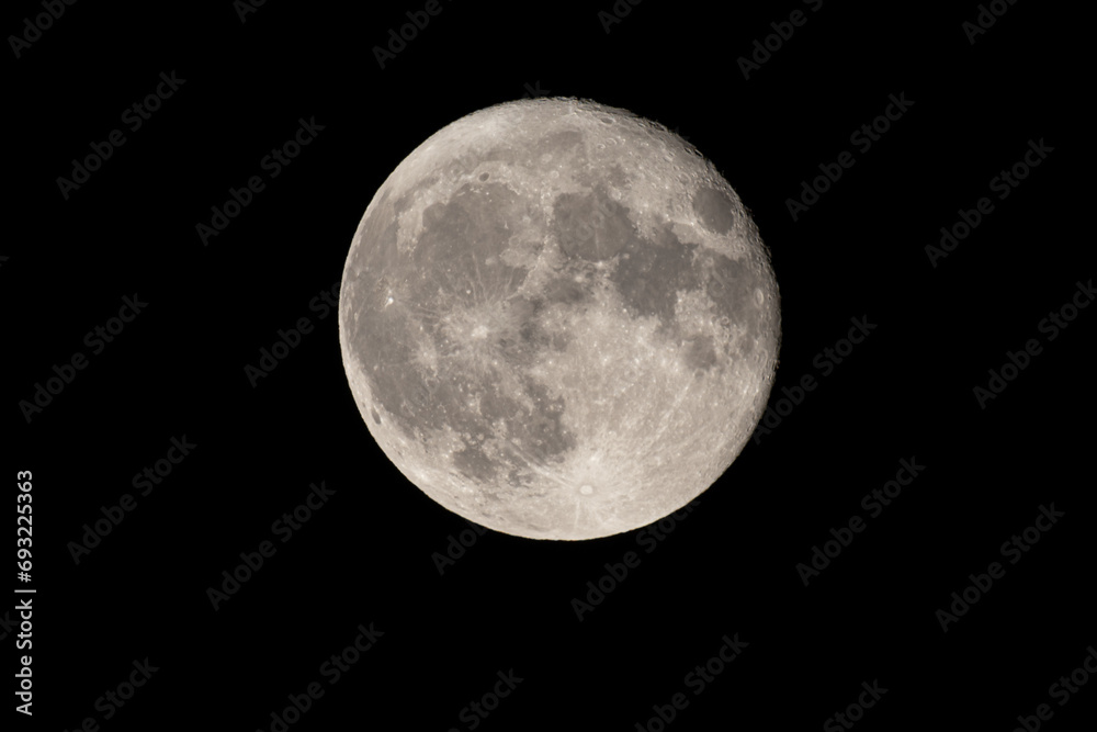 Wall mural full moon photographed with a telescope and reflex camera where the craters on the lunar surface can