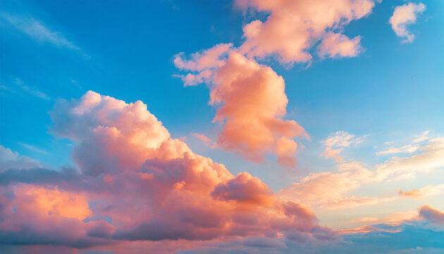 Beautiful natural background with blue sky and pink fluffy clouds at sunset