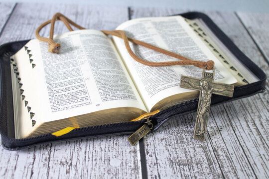 Spirituality, Religion and Hope Concept. Holy Bible and Cross on Desk. Symbol of Humility, Supplication