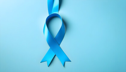 Blue ribbon on solid background with copy space. Movember campaign symbol. Prostate cancer awareness month.
