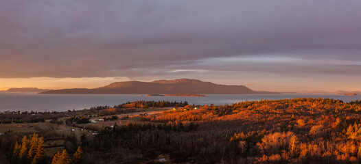 Aerial View of Sunrise Over Orcas Island, Washington. Located in the Salish Sea, Orcas Island is...