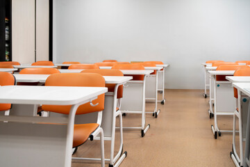 back to school concept, empty classroom with white tables and chairs