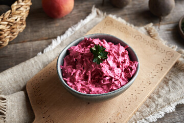 A bowl of beetroot salad with sour cream