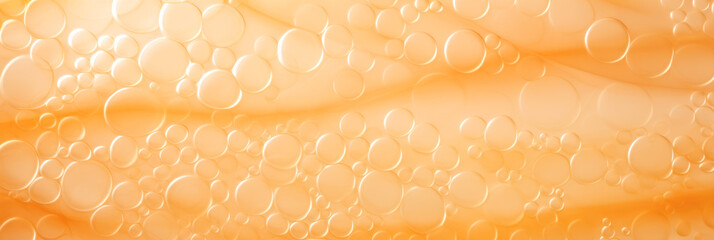 A close up of bubbles in a glass of water. Monochrome peach fuzz background.