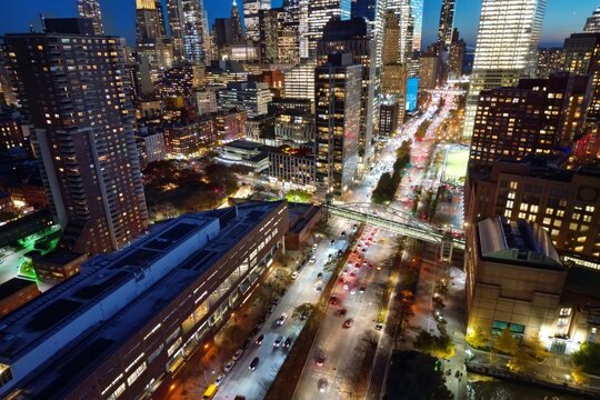 Night New York City, Manhattan famous top view. Manhattan from above. NYC panorama. NYC skyline at twilight. New York famous building. Night traffic in NYC. Lower Manhattan. Night NYC from drone.