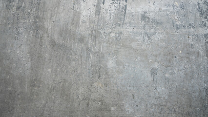Buildings have cement walls that look like metal sheets. rough surface The silver body is contaminated with gray and black stains. There are uneven scratches. Suitable for use as a background image