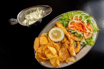 Fried cuttlefish served in a Portuguese restaurant, showcasing a delicious local seafood delicacy.
