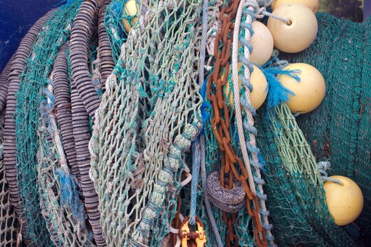 Close up of colourful fishing nets in a British village, decorative and printable photo, 