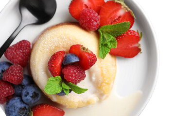 Delicious vanilla fondant served with fresh berries on grey table, top view