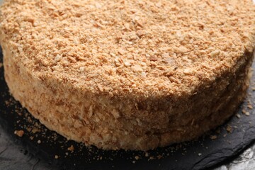 Delicious freshly baked Napoleon cake on table, closeup