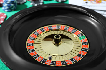 Roulette wheel with ball on table, closeup. Casino game