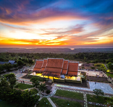 Aerial view of Wat Sirindhorn Wararam glowing temple in Ubon, Thailand